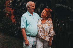A smiling older couple. Annuities are just one way to plan for retirement.