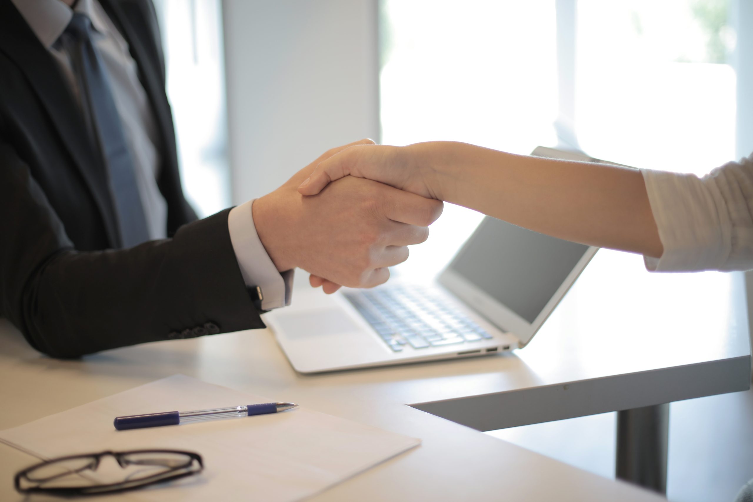 Two people shaking hands. Trust is an important aspect of working with a fiduciary.